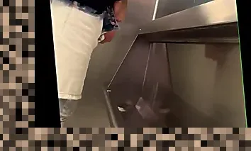 pissing at toilet
